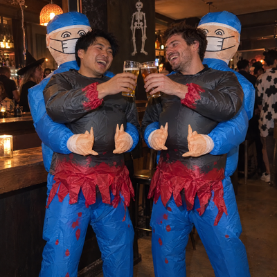 Two friends in matching Malpractice costumes